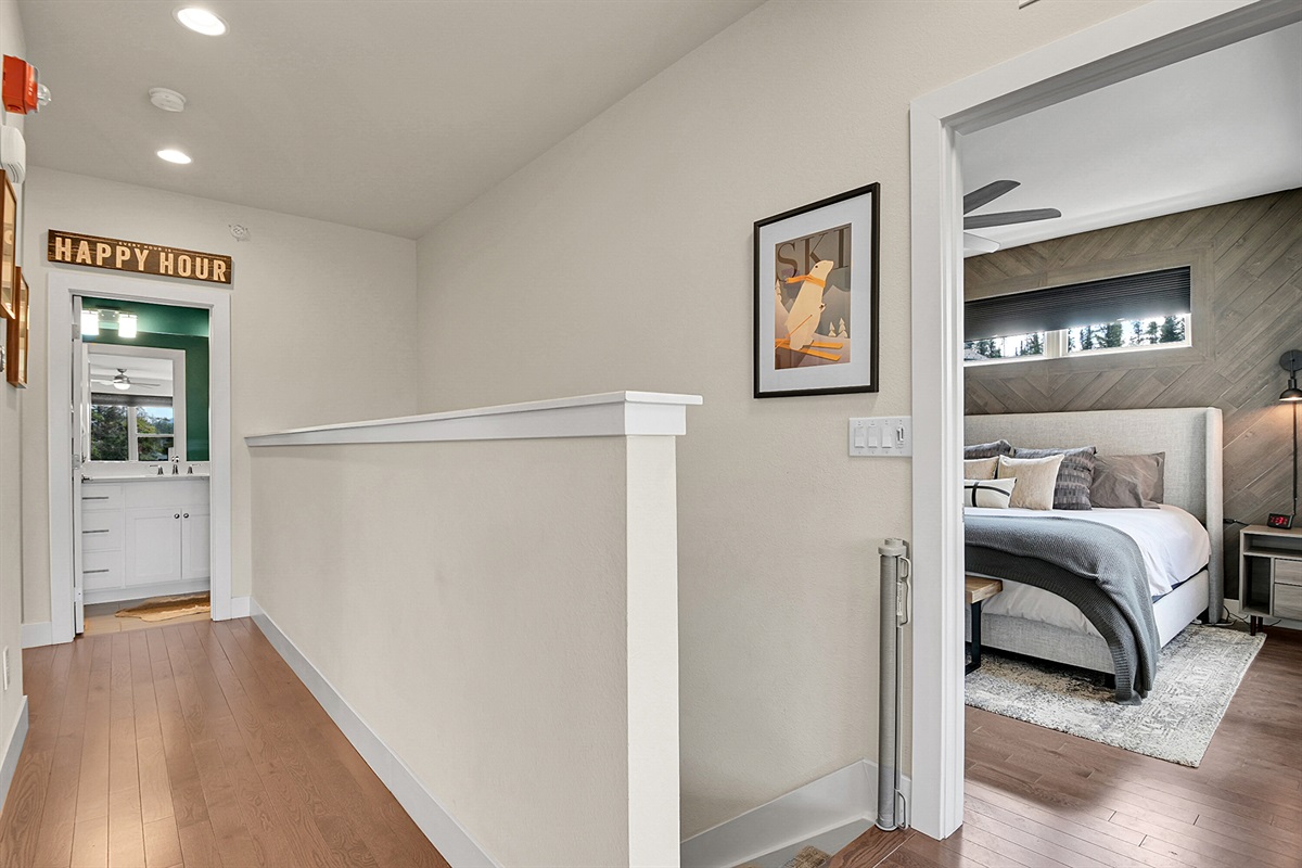 Hallway to Wood Bedroom and half bathroom on main level