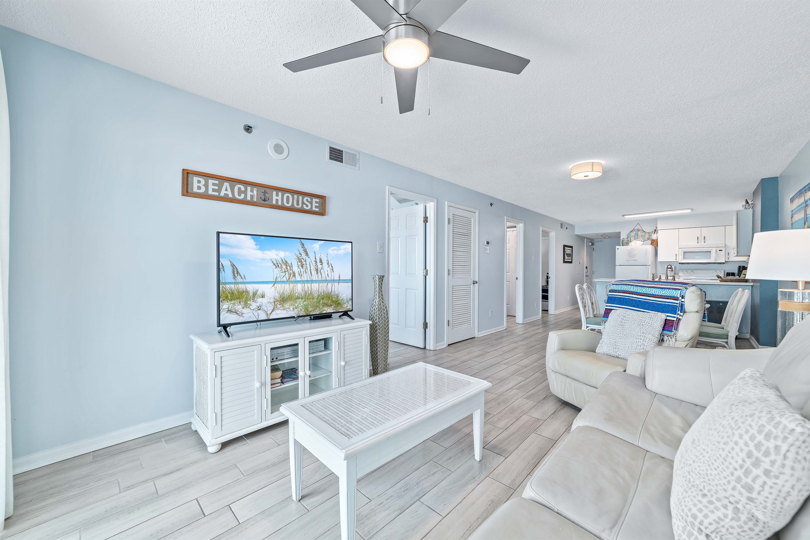 This well-appointed living space offers a convertible sofa bed, a coffee table, and a dining area with seating for six, creating a welcoming atmosphere.