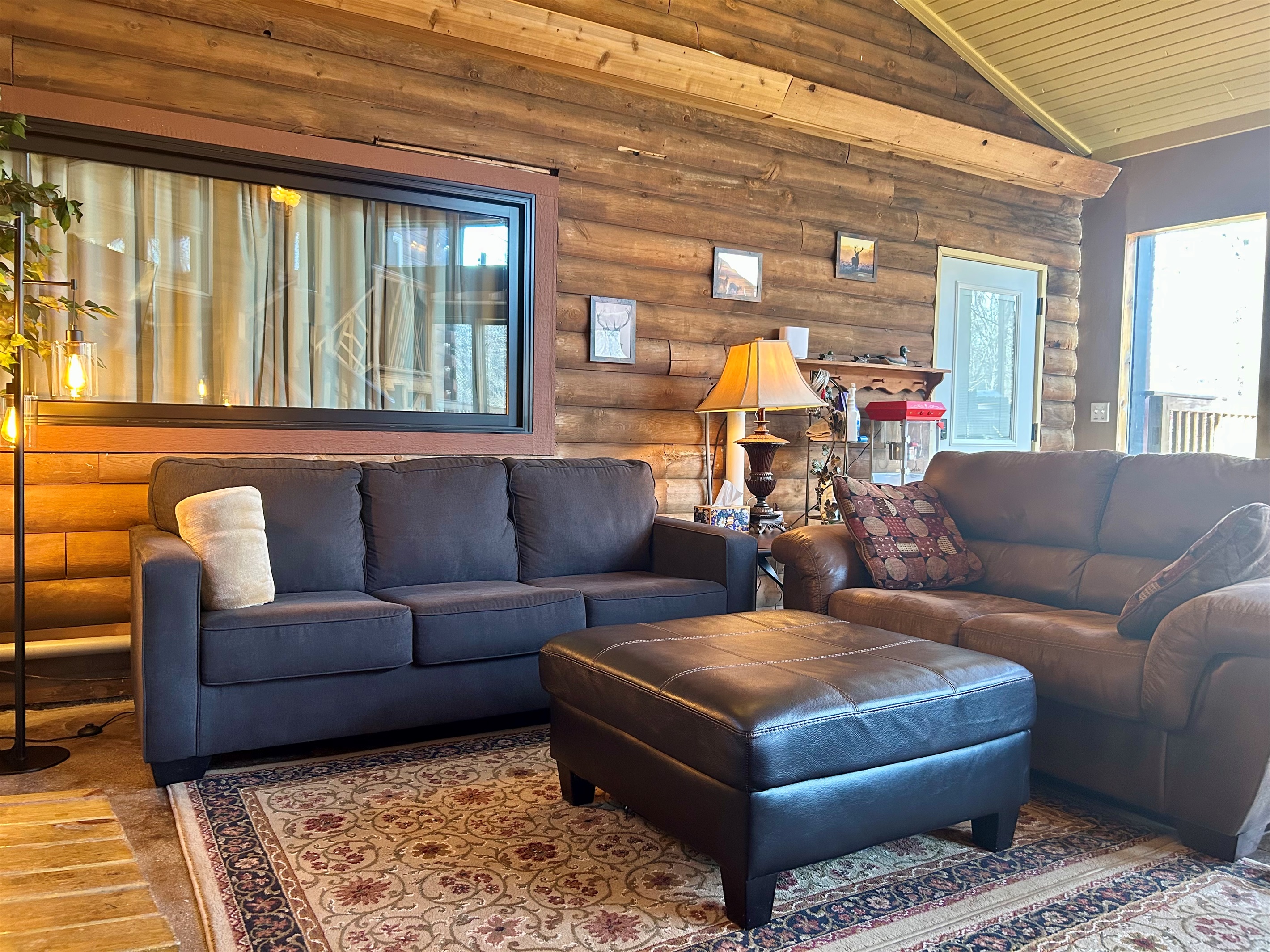 Window above couch can be curtained off or opened for for open line of sight to the Guest Quarters. The door to the Guest Quarters also has blinds that can be opened or closed for privacy.