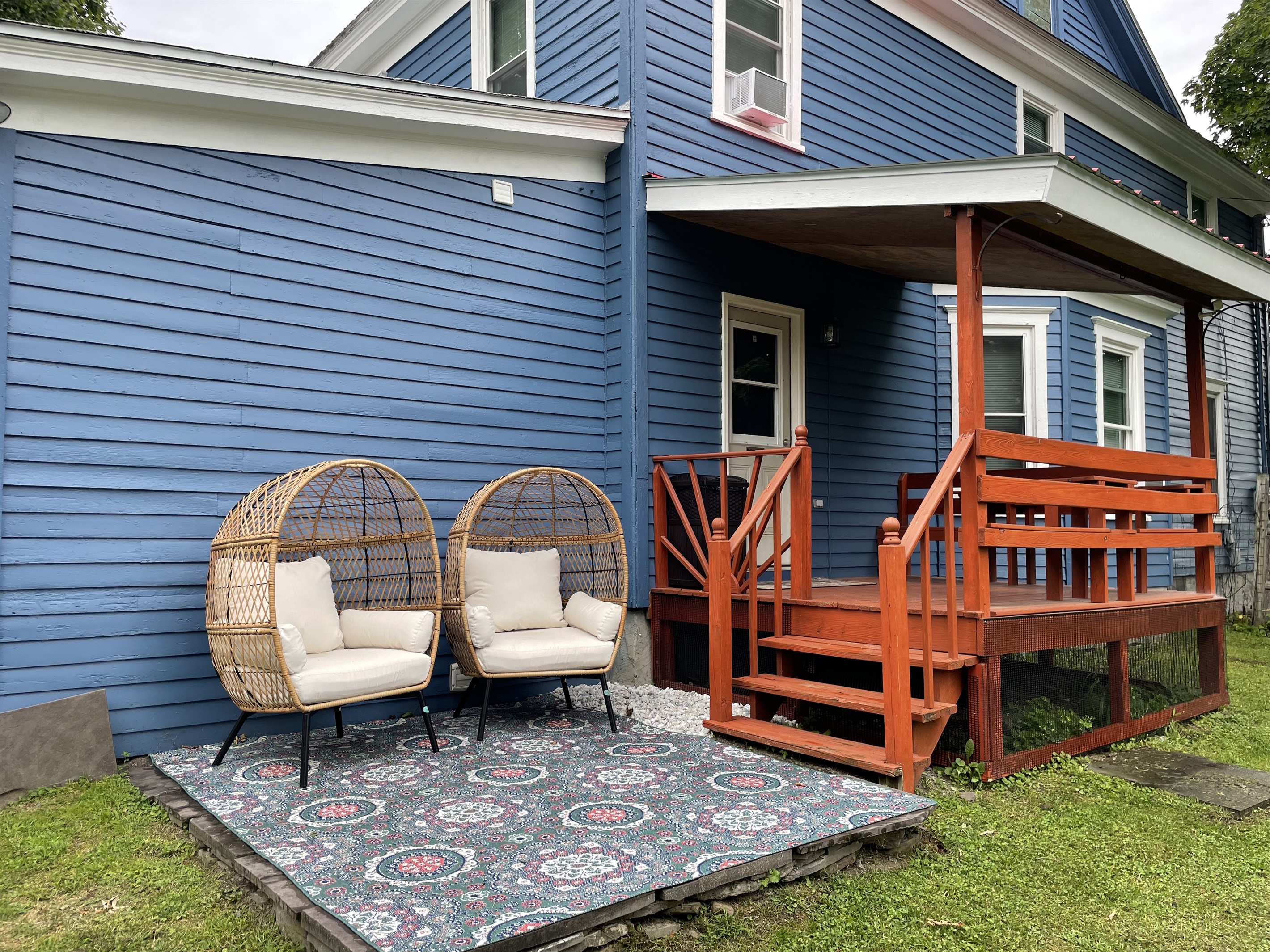 Covered side porch and cozy seating