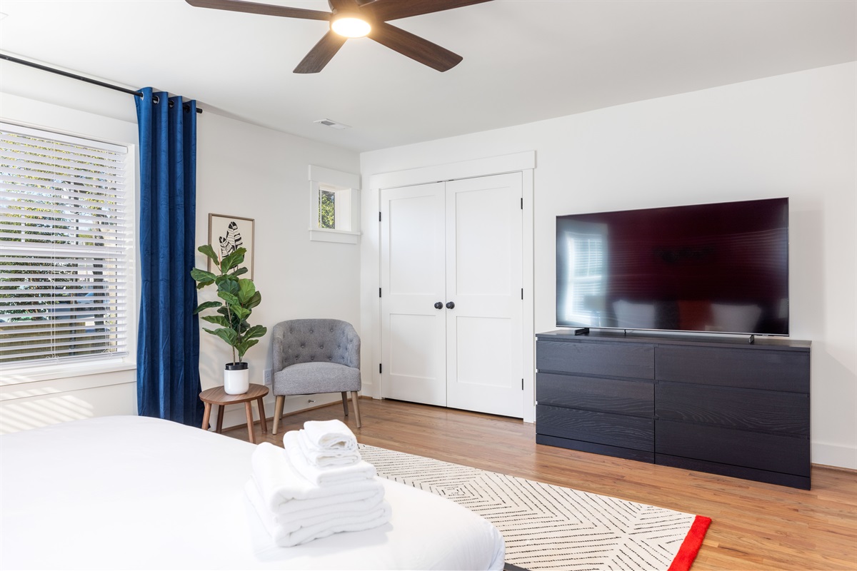 Large Smart 65" Samsung Smart TV in the primary King bedroom upstairs. Watch your favorite shows in bed! 