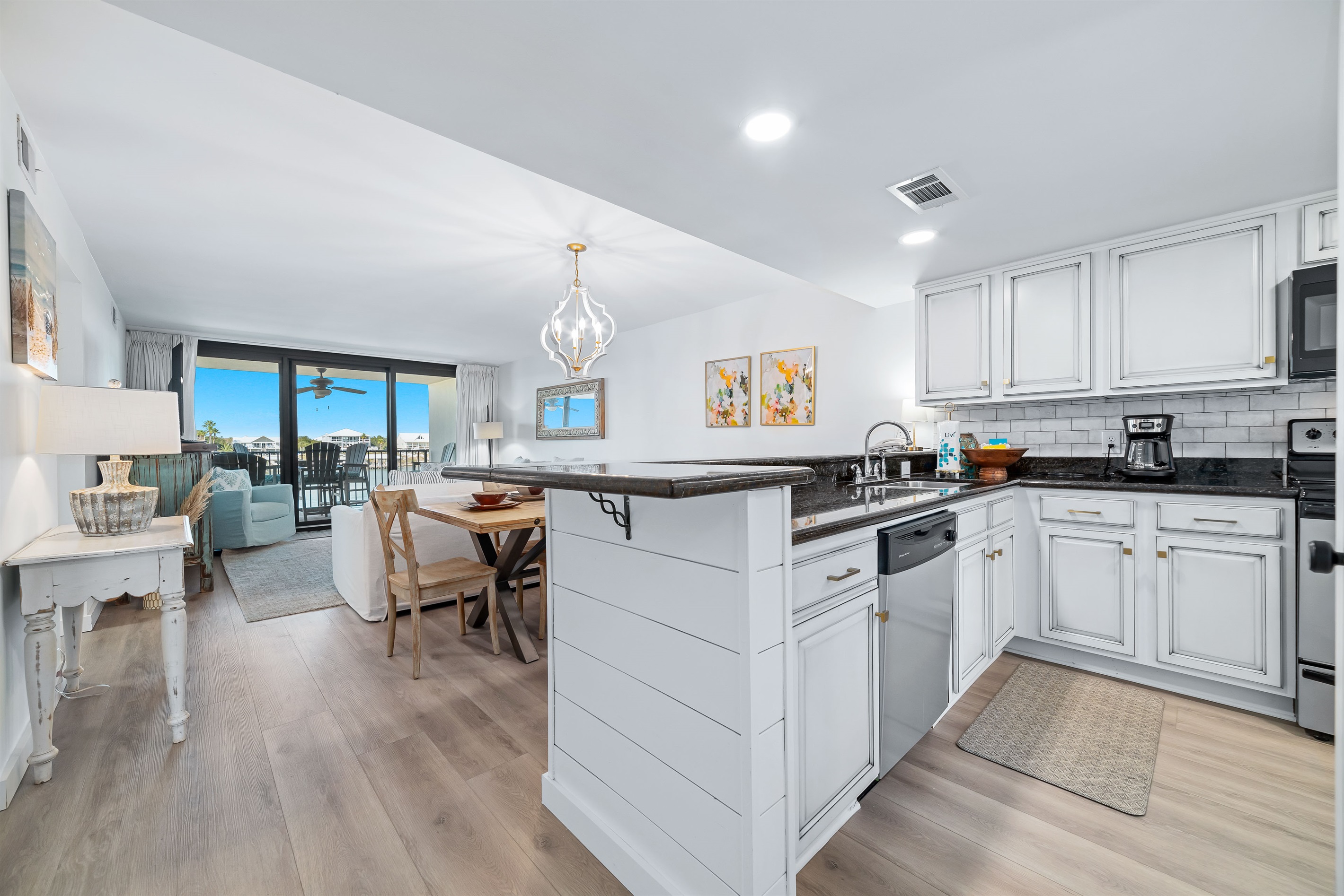 Bright and airy kitchen with ample counter space and modern amenities, creating an inviting space for cooking and gathering.