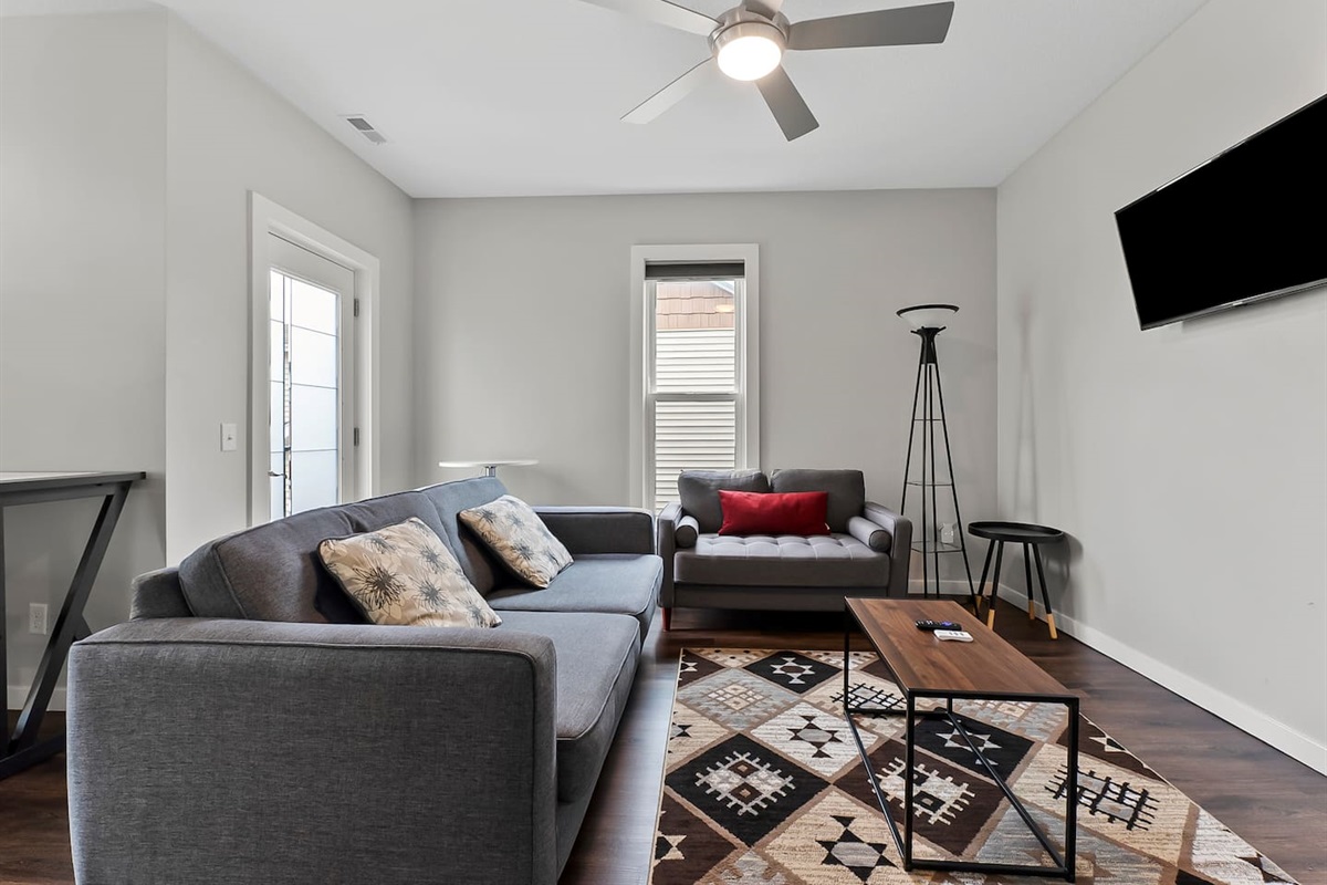 Comfortable sofas and thoughtful accents create the perfect spot to unwind or gather with friends.