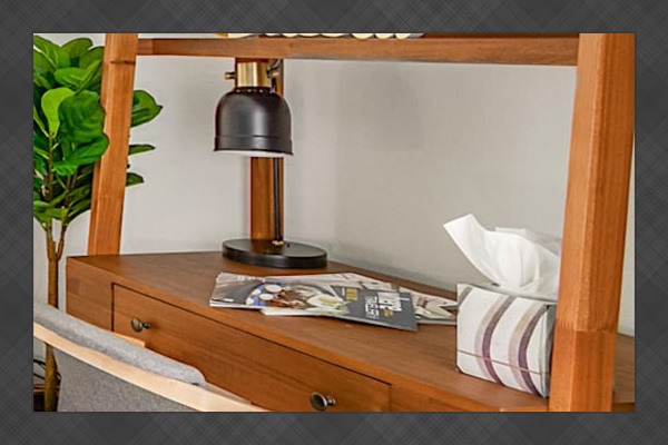Work area with desk lamp and storage, useful for remote work or planning the day.
