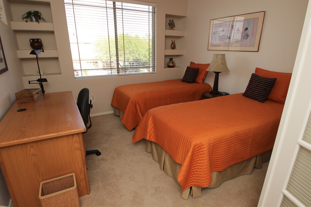 Twins and desk work area in guest bedroom