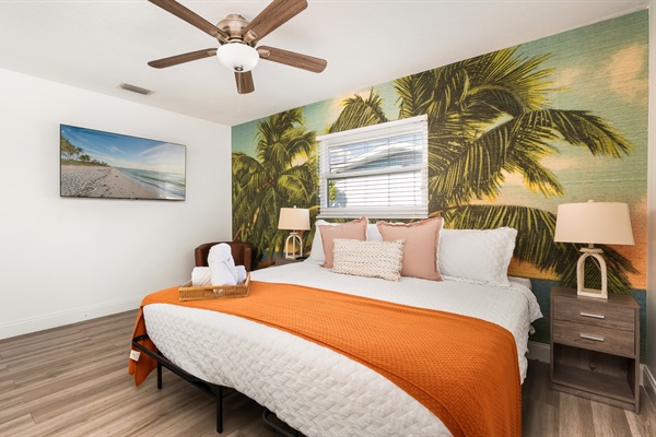 Big bed. Big palm trees. Big vacation energy. This room was made for long sleeps and pool dips (access to pool directly from connected en suite bathroom).