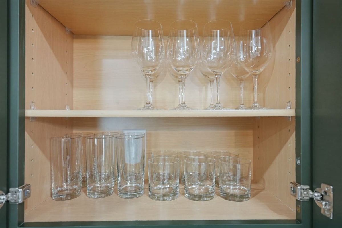 Cabinet stocked with wine glasses and drinking glasses—perfect for entertaining, enjoying a glass of wine, or relaxing with your favorite beverage.