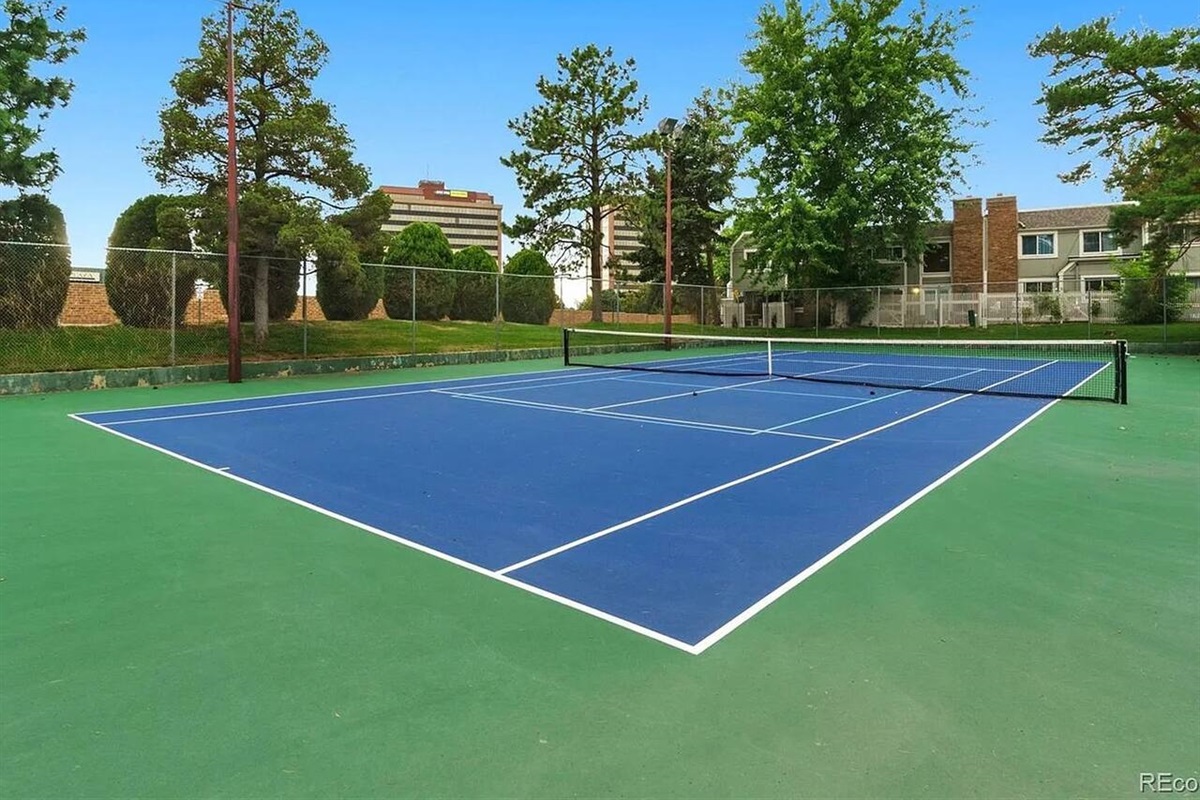 Community tennis court just a short walk from the home.