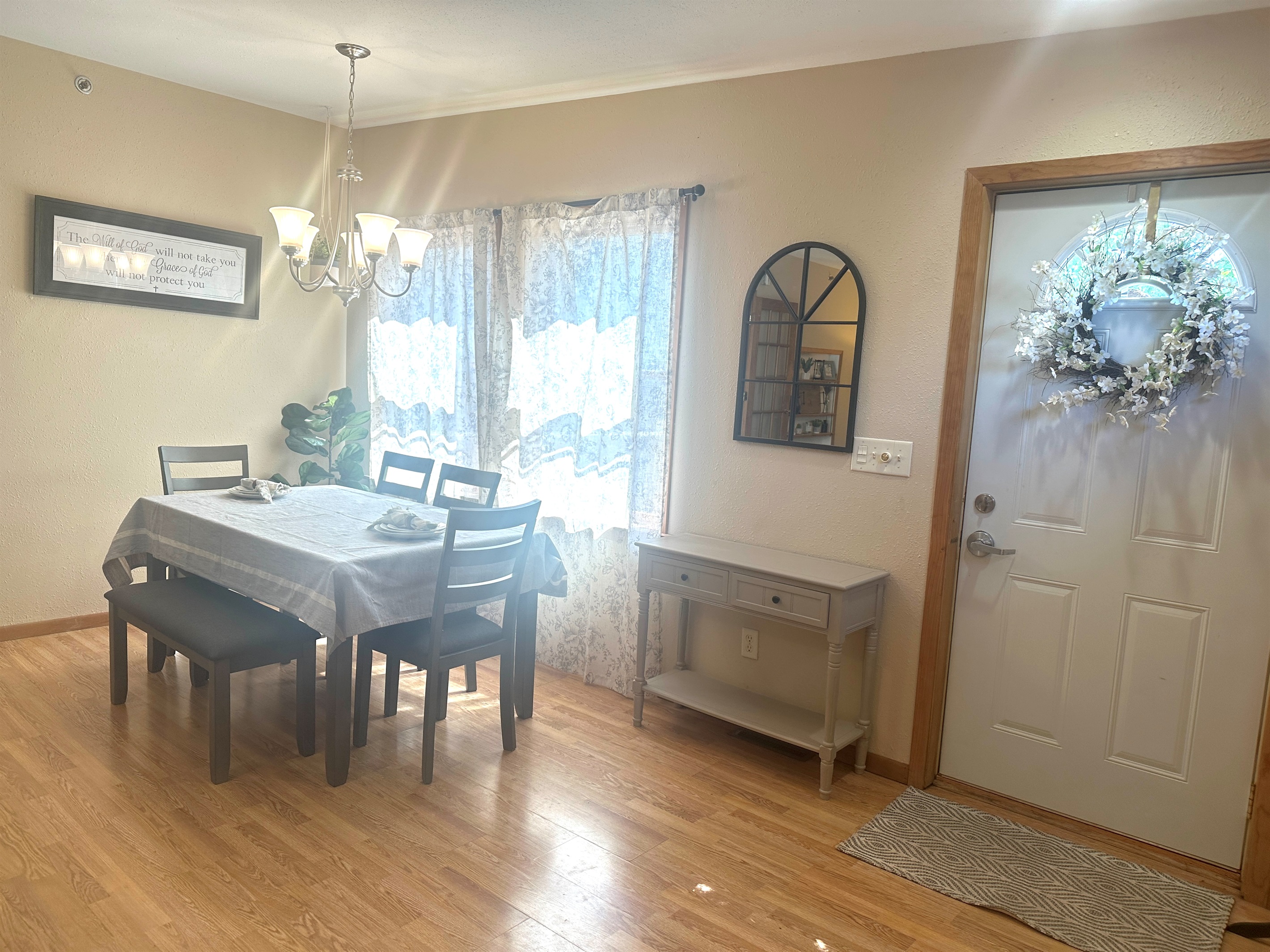 The front door leads out onto the large deck with intermittent views of Lake Pepin.