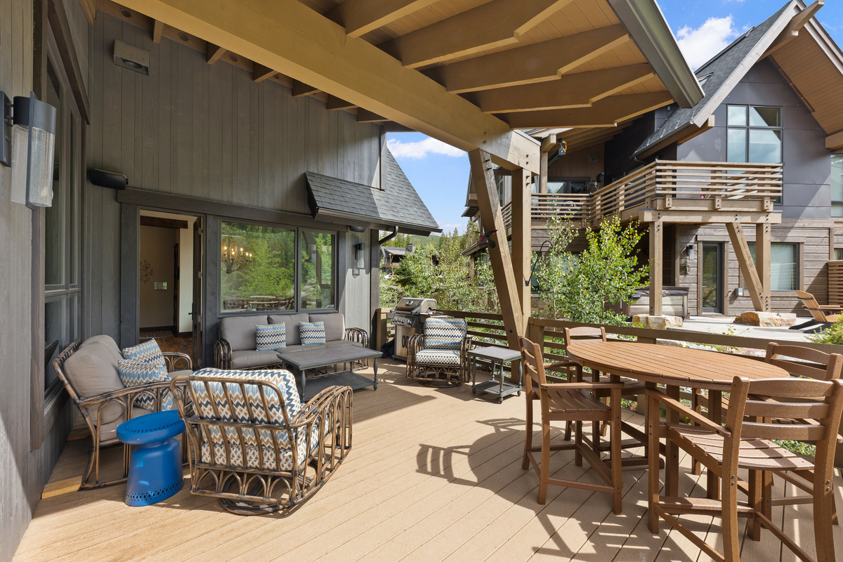 Upper deck off main level with gas grill and ample seating. You will want to sit here and listen to the river all day. 