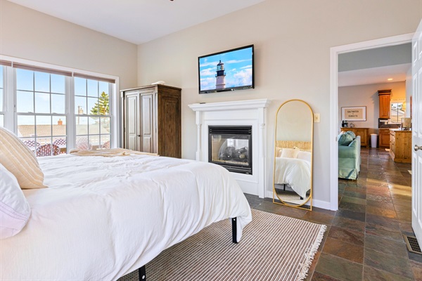 Retreat to the master bedroom, where a cozy double-sided gas fireplace sets the perfect mood!
