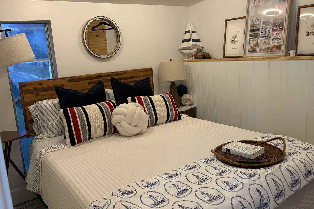Bedroom #2 with nautical charm and a Queen bed.
