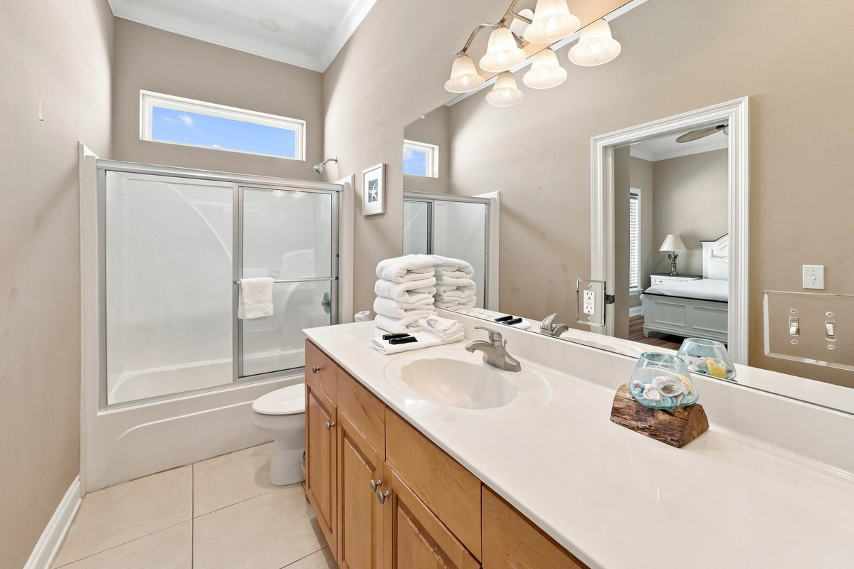 Bathroom with a walk-in shower and single vanity