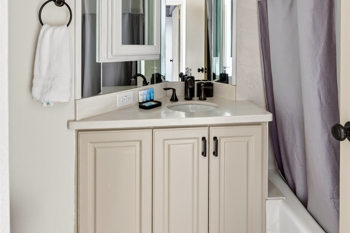 Downstairs Bathroom 1 features a convenient tub-shower combination