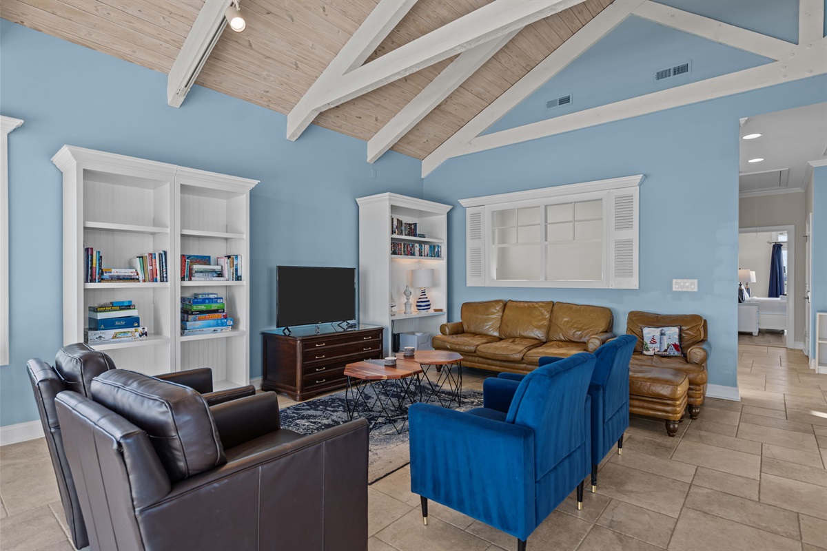 3rd floor living room features games, smart TV, books, and ocean views