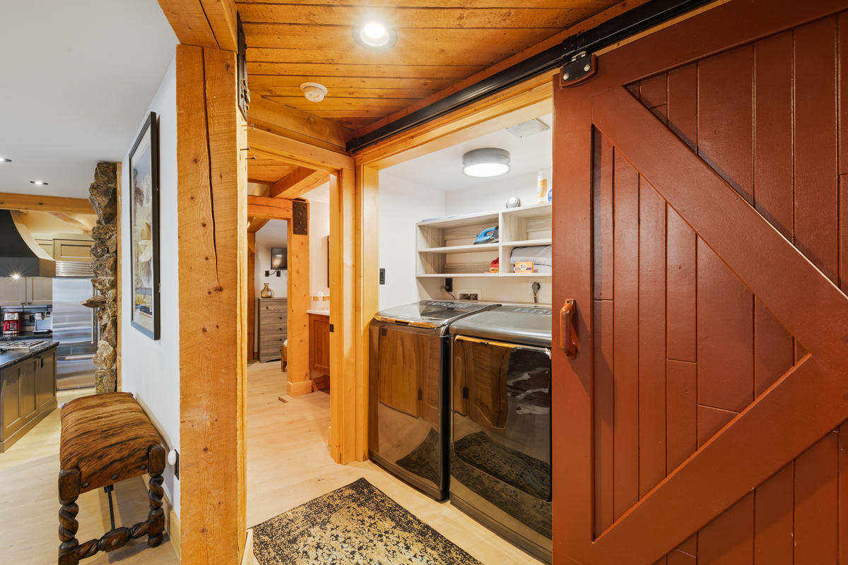 Full-size washer and dryer with barn door closure