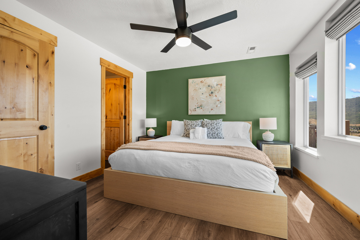 Wake up to a bright King bedroom with warm finishes and beautiful natural surroundings.