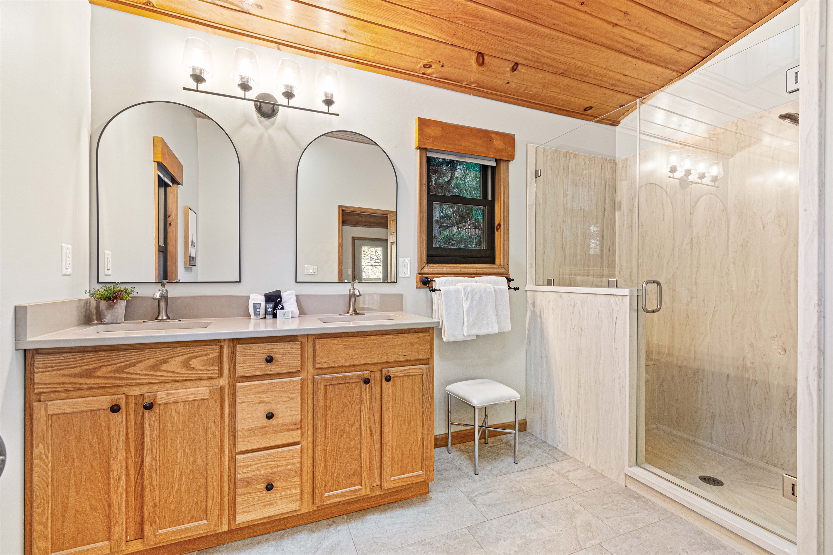 Updated bathrooms offer walk-in shower, double vanity and lots of space.