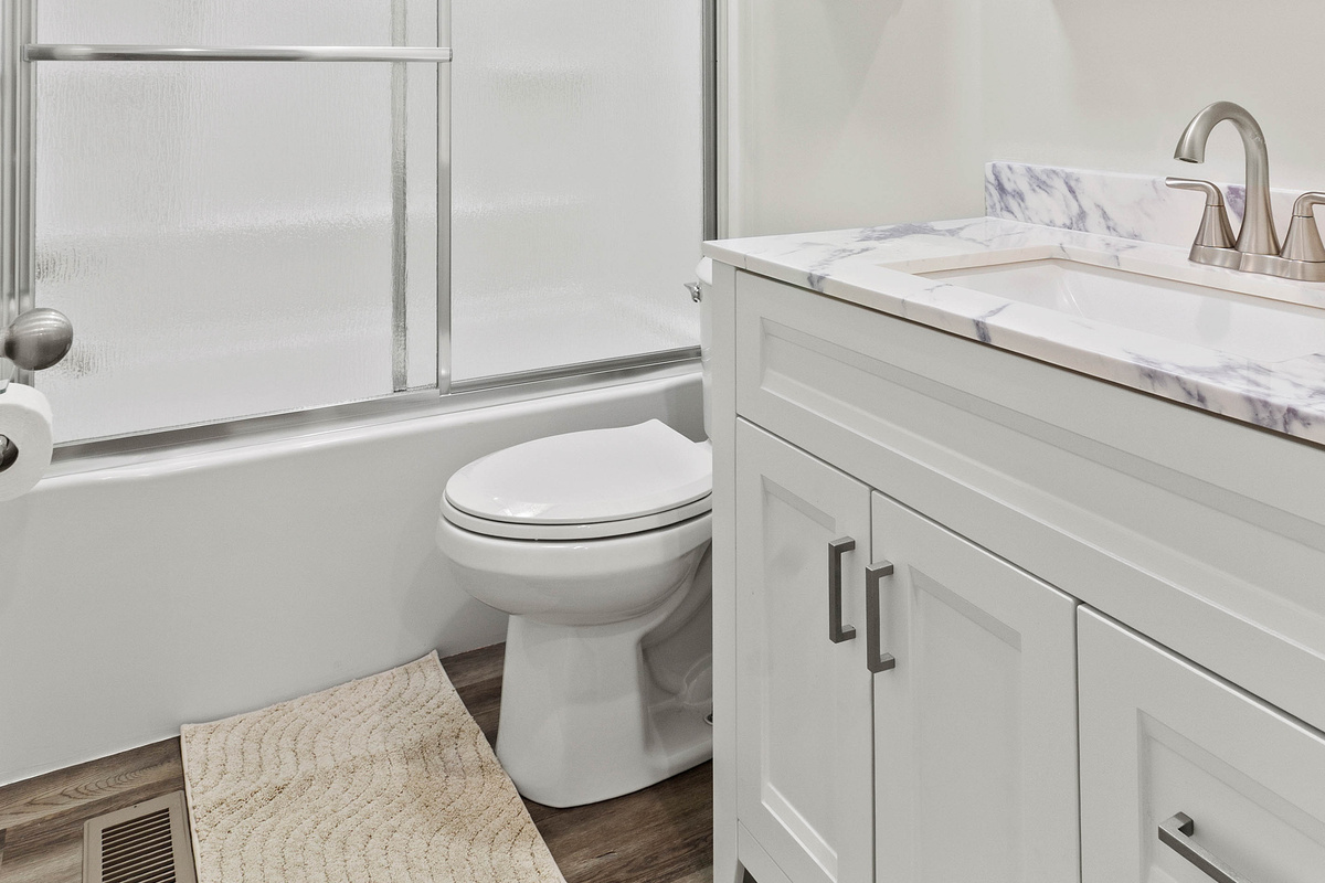 The Waterbury Way - Secondary Bath with vanity cabinet, vanity with hair dryer, make-up mirror and make-up removal wipes