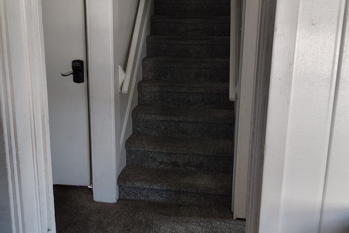 Stairs heading to upstairs of house