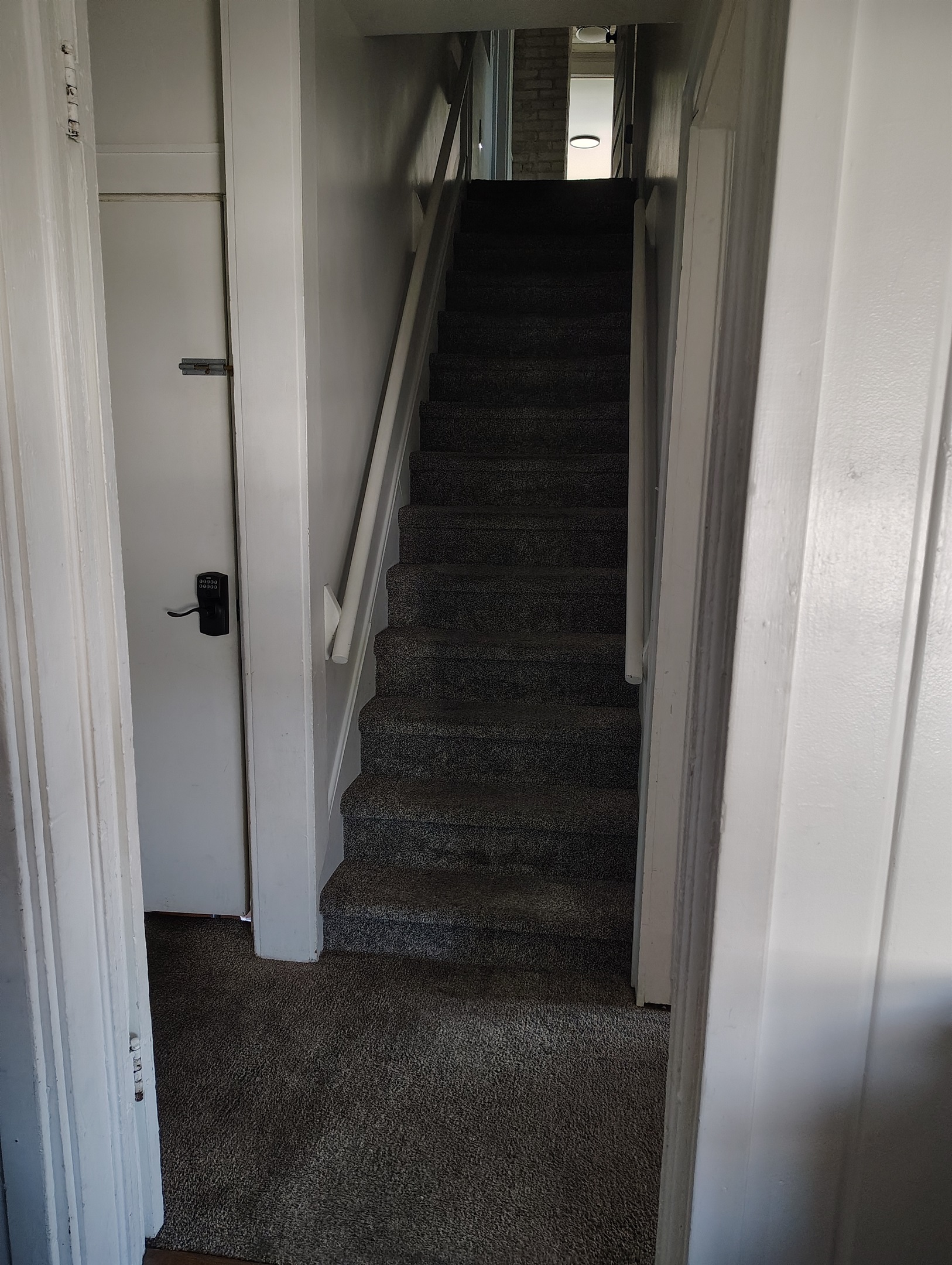 Stairs heading to upstairs of house