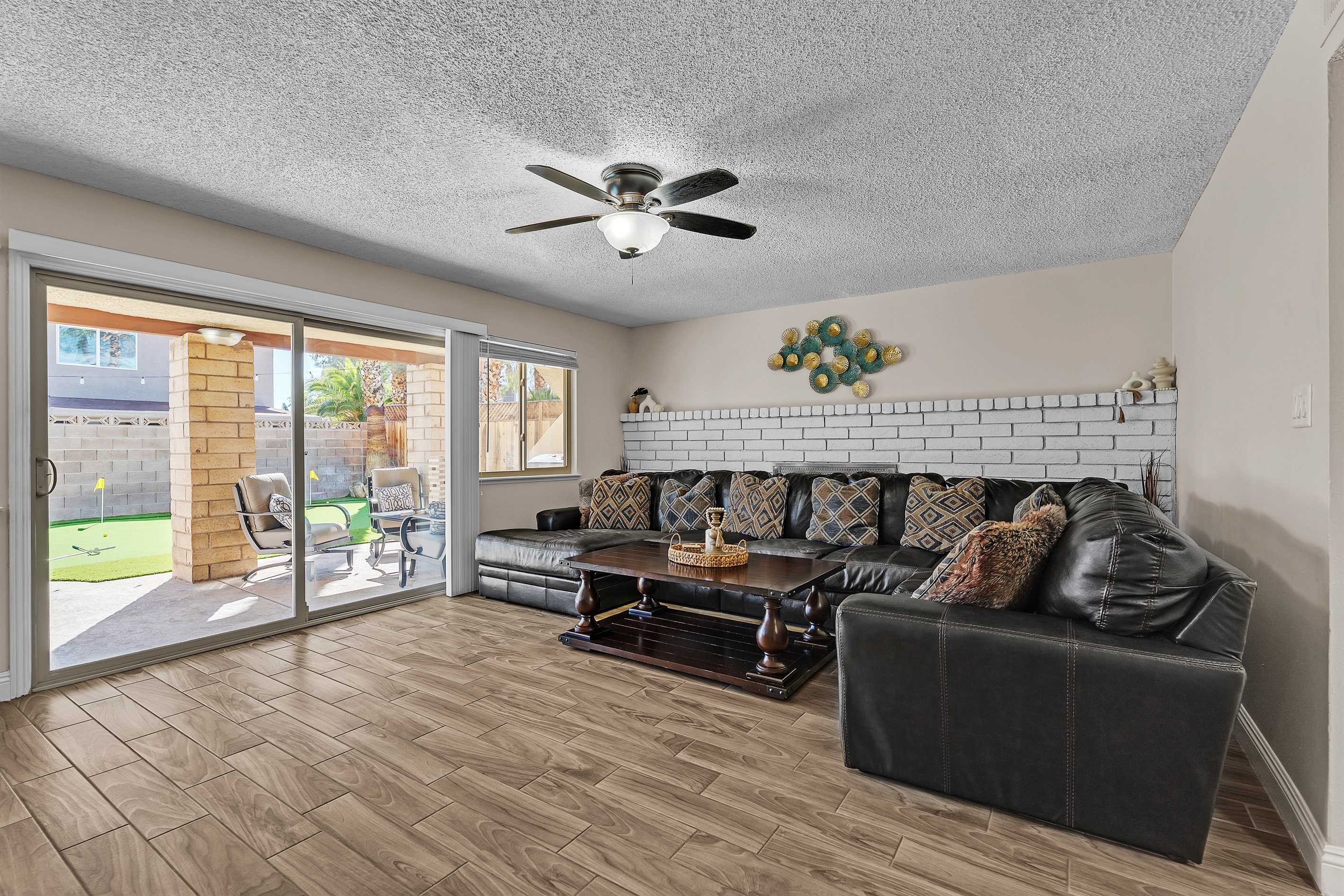 Living room 2 with 86 inch tv, shuffleboard, Nintendo switch, karaoke and bar sink