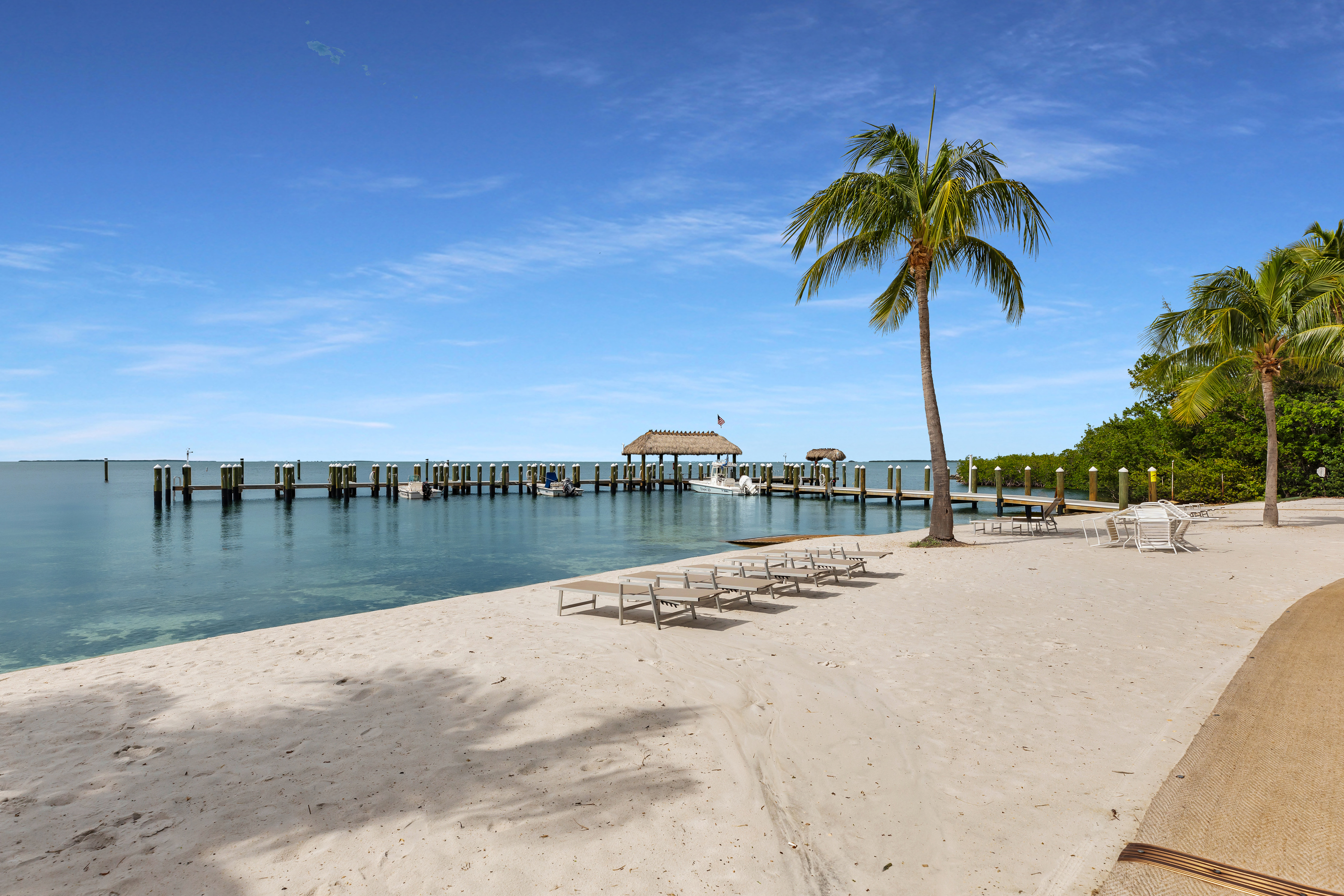 Sandy beach with lounge chairs overlooking the crystal clear Florida Bay. Enjoy a world famous Florida Keys sunset each night!