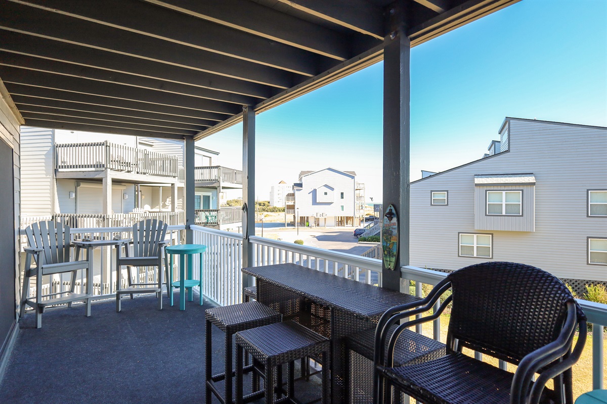 Balcony outdoor seating area with various furniture options
