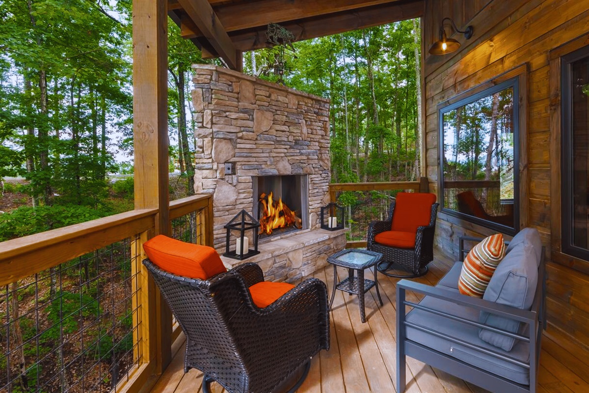 Unwind outdoors by the propane fireplace on the upper seating deck.
