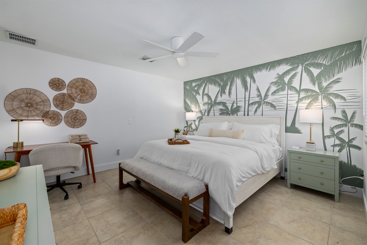 Your private coastal retreat 🌿
A light-filled primary suite with cozy seating, workspace, and peaceful design touches.