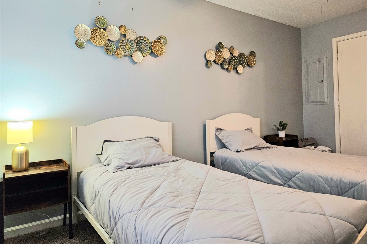 Offering versatility and design, this spacious guest room bring flexibility with two identical twin side beds, matching night stands and plenty of storage. Unique decor and natural light make this room a family friendly option.