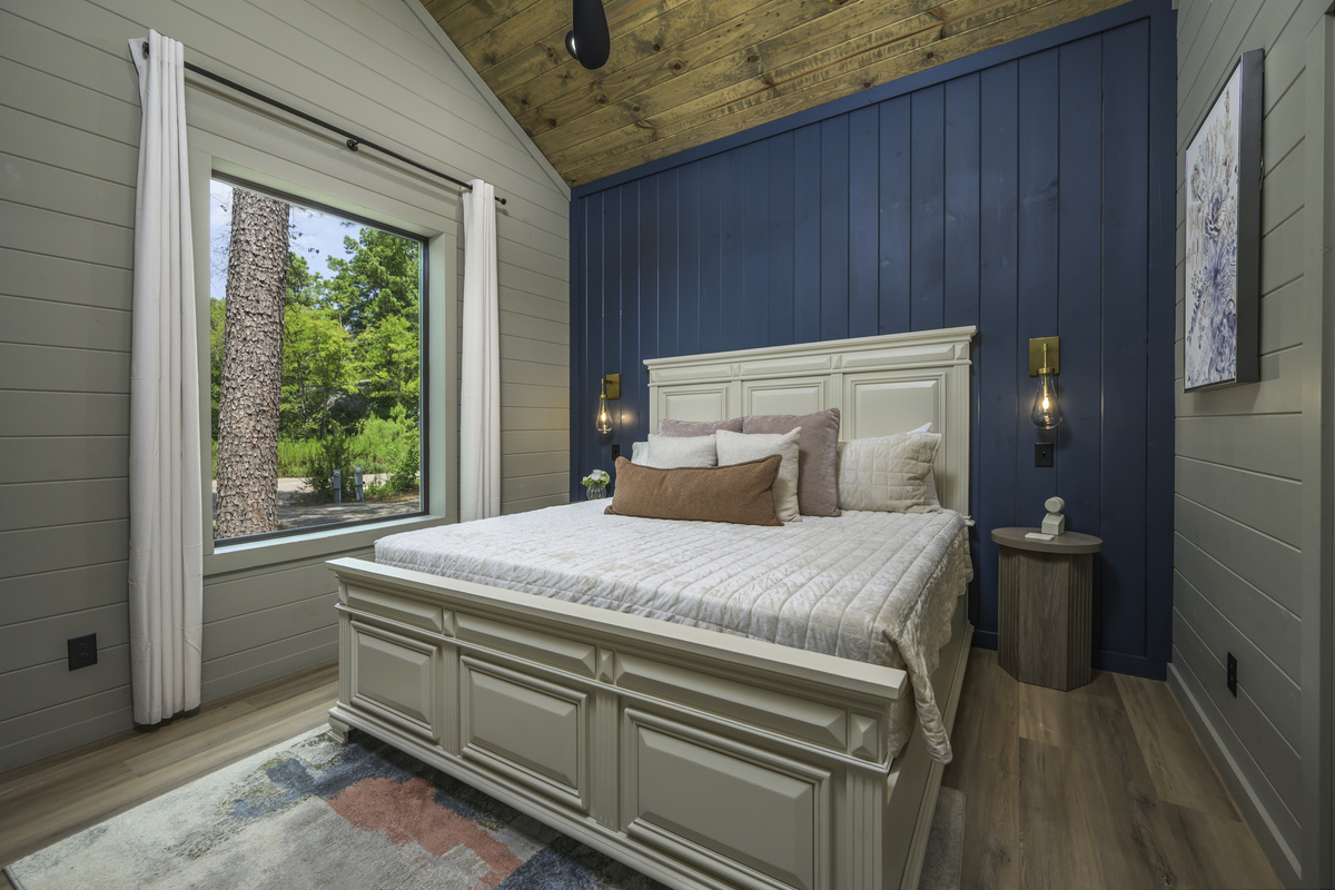 Bedroom Retreat: Elegant decor and tranquil views create the perfect escape for relaxation!