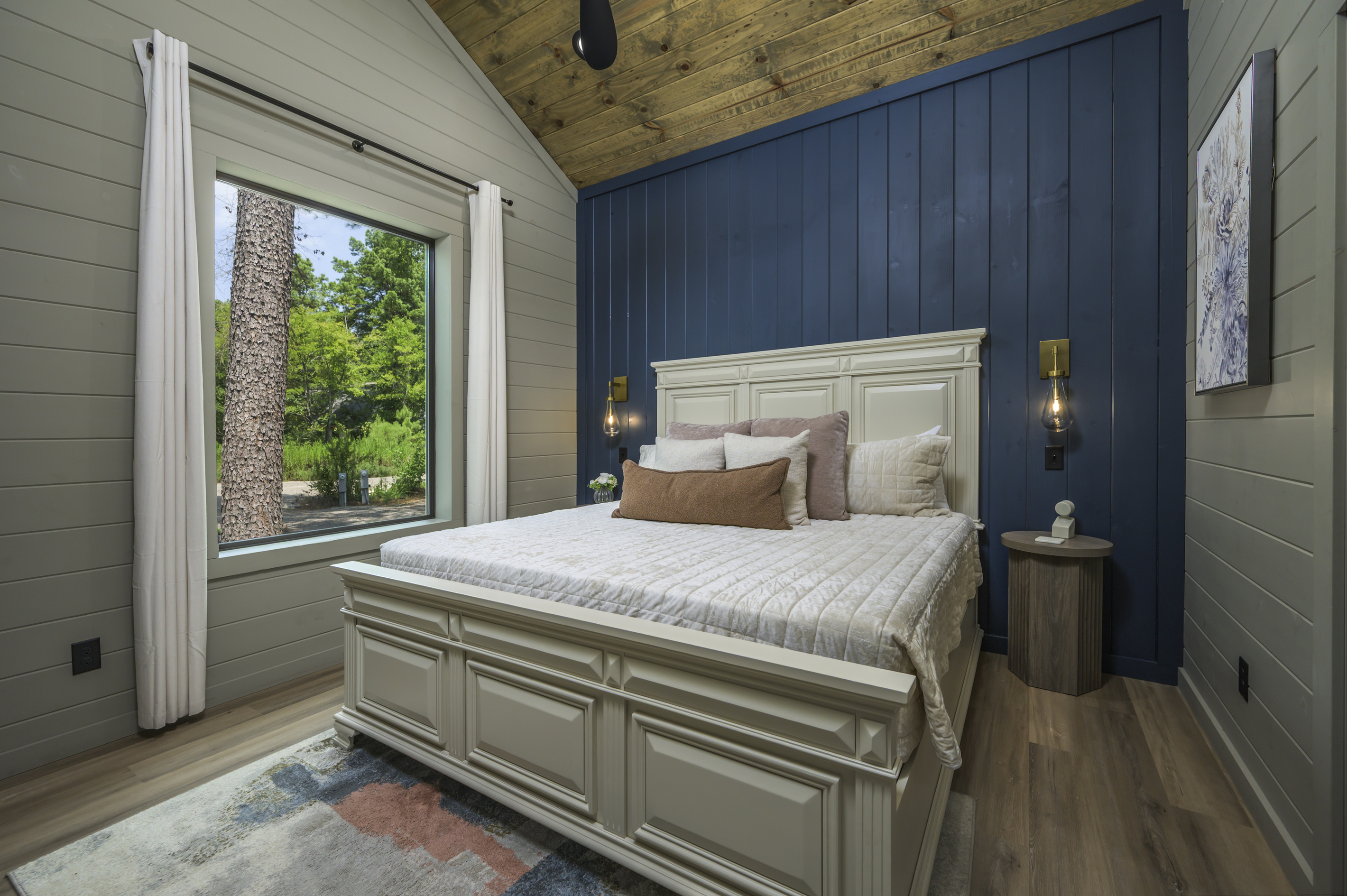 Bedroom Retreat: Elegant decor and tranquil views create the perfect escape for relaxation!