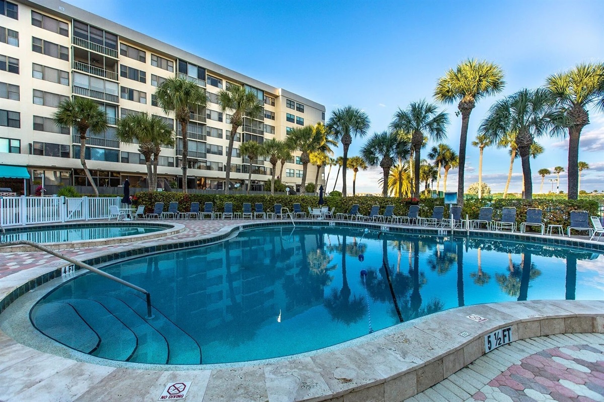 Alternate view of the pool deck and lounge seating area.