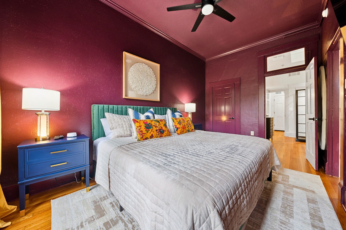 A closer look at the king bed highlights its inviting design and soft details, complemented by warm lighting.