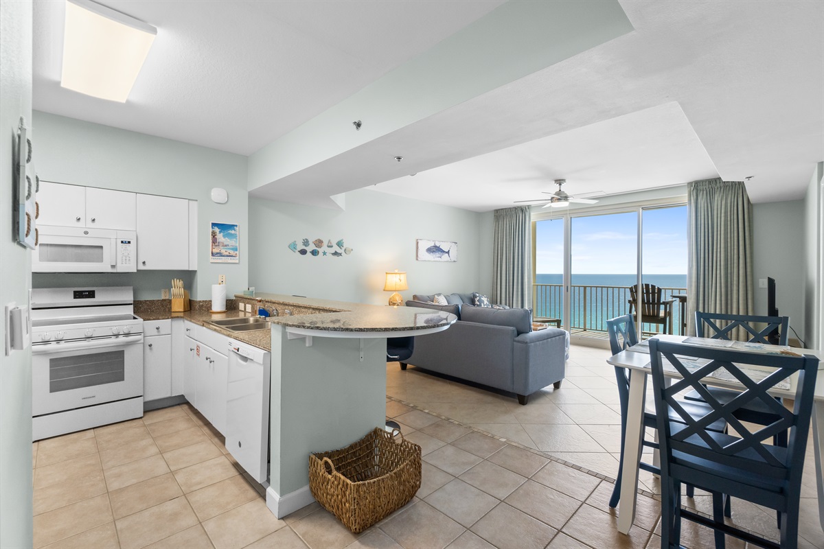 Nice open concept between the kitchen, dining and living room area. You can see the ocean as soon as you walk in!