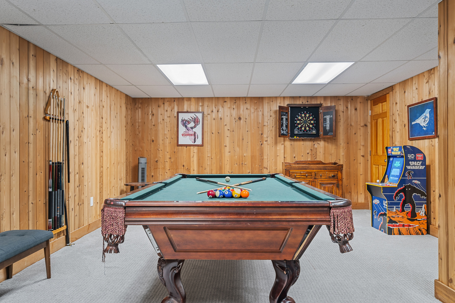 Pool table and classic arcade cabinet in the game room at First Chair Lair