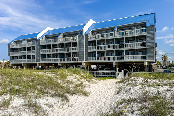 Building sits right at the dunes, just steps from the sand