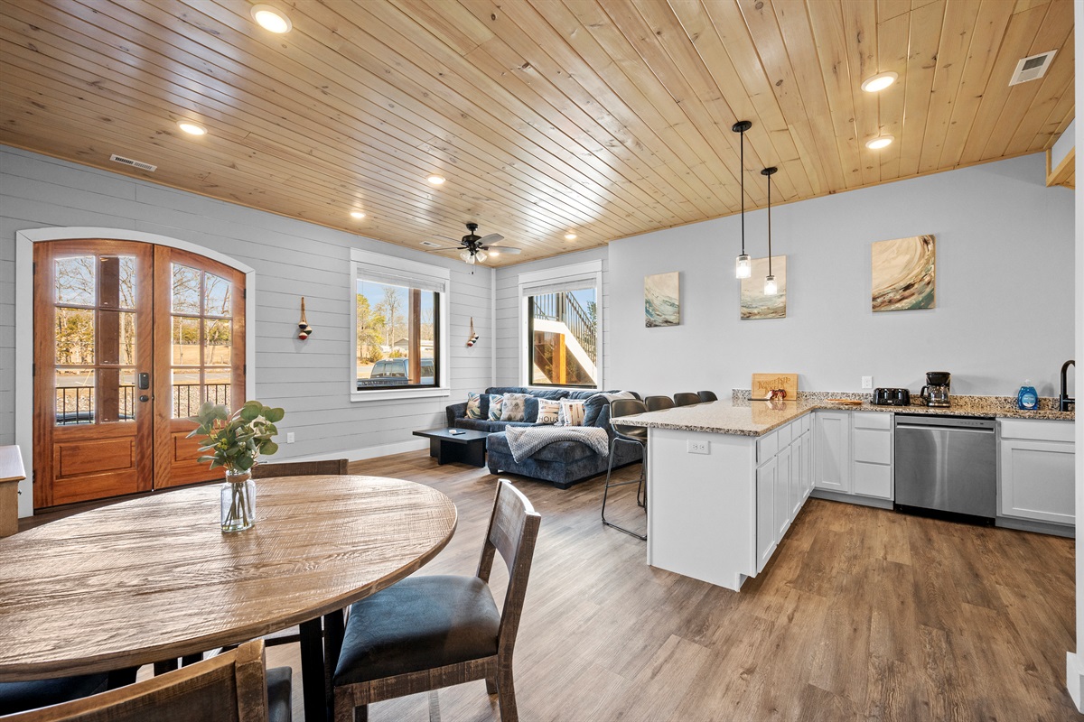 Dining and living area with direct access to the deck. Enjoy indoor-outdoor flow that makes entertaining easy and relaxing.