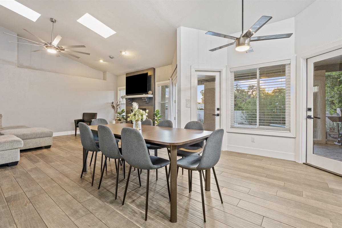 Gather around for breakfast or dinner in this open dining area with stylish seating and space for the whole crew.