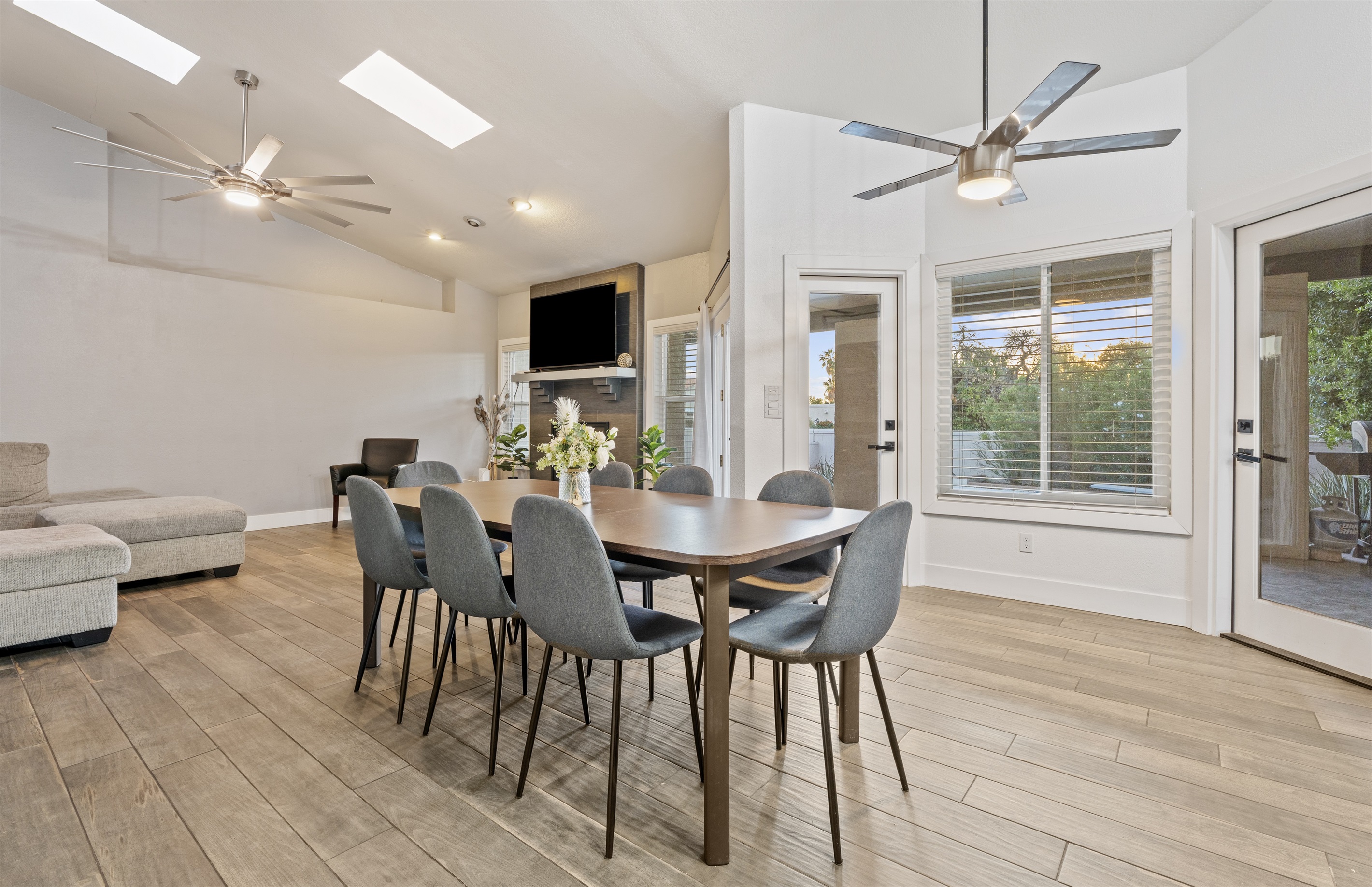 Gather around for breakfast or dinner in this open dining area with stylish seating and space for the whole crew.