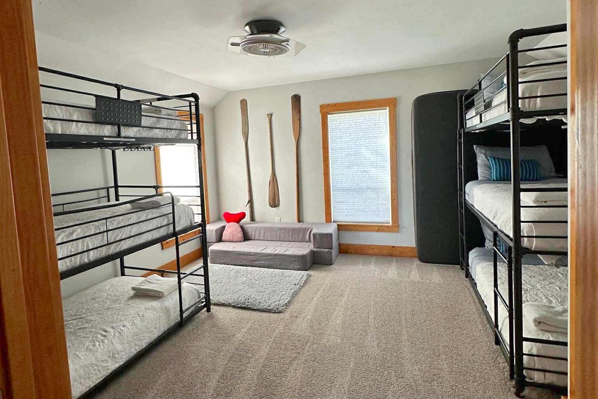 Two triple bunks and charming decor make bedroom #2 a fun place to sleep.