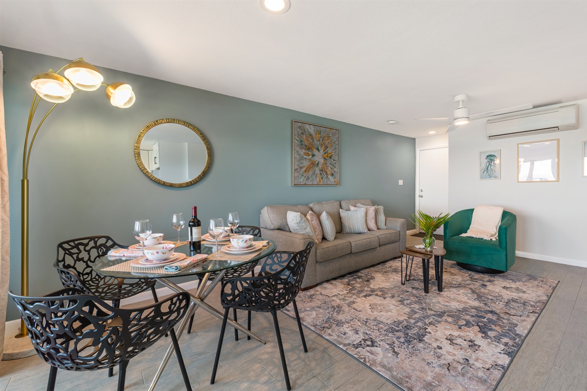 Large open living area with sleeper sofa, Smart TV and dining area.