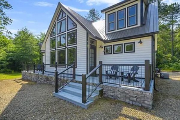 Charming exterior with modern design and inviting front porch.