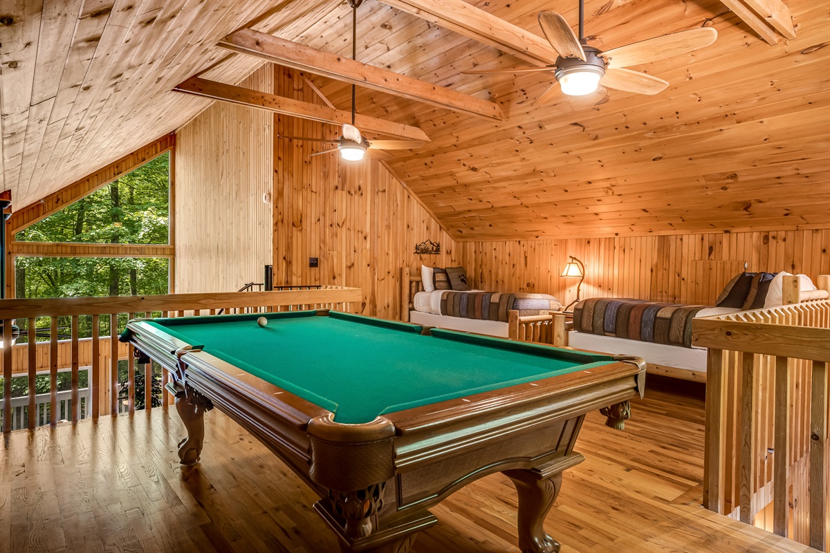 In the loft you will find a pool table and 2 twin beds