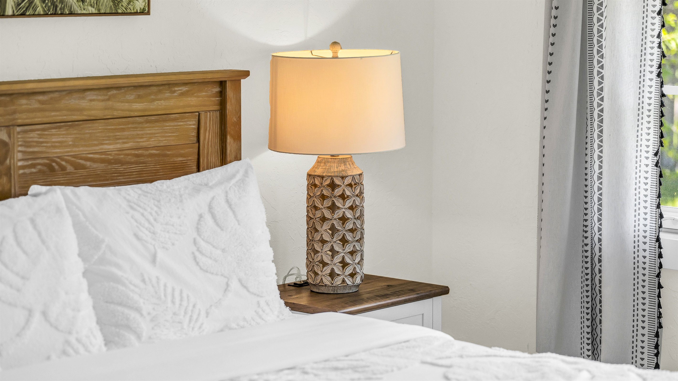 Bedroom 2 offers a relaxing coastal vibe with crisp linens, warm natural light and elegant decor- perfect for guests seeking comfort and tranquility after a day in paradise