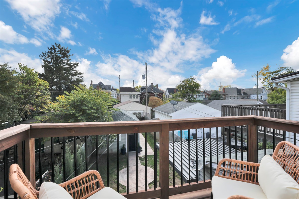 A charming balcony off the rear bedroom