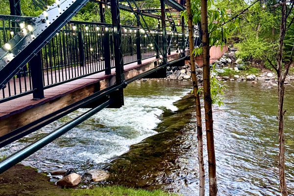 Beautiful lit bridge connecting the two walking paths near the condo