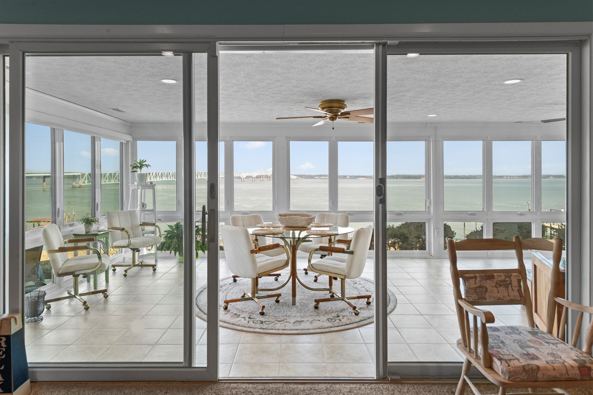 Sunroom Retreat: Enjoy panoramic views and delightful gatherings in this airy, inviting space!