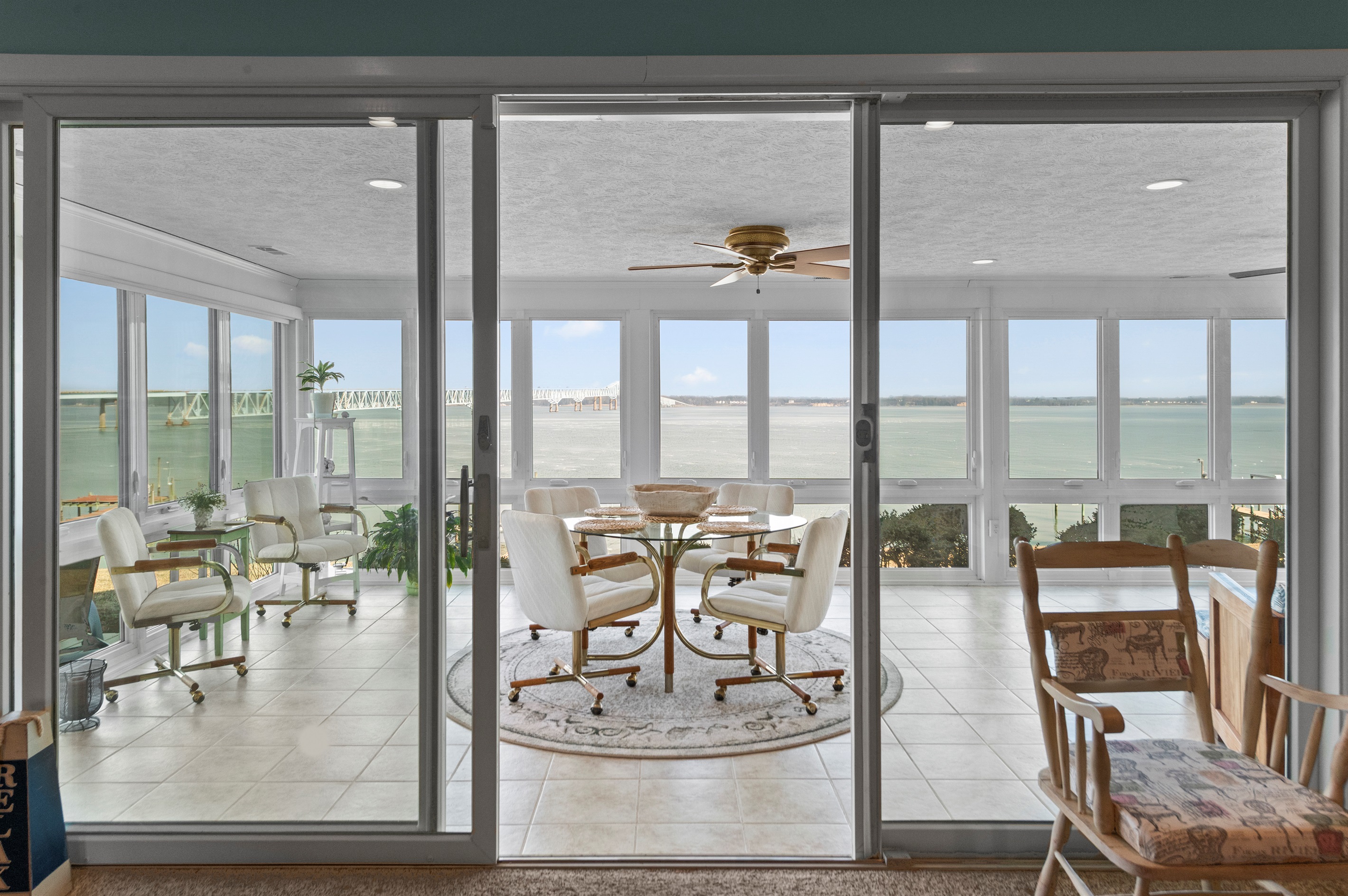 Sunroom Retreat: Enjoy panoramic views and delightful gatherings in this airy, inviting space!